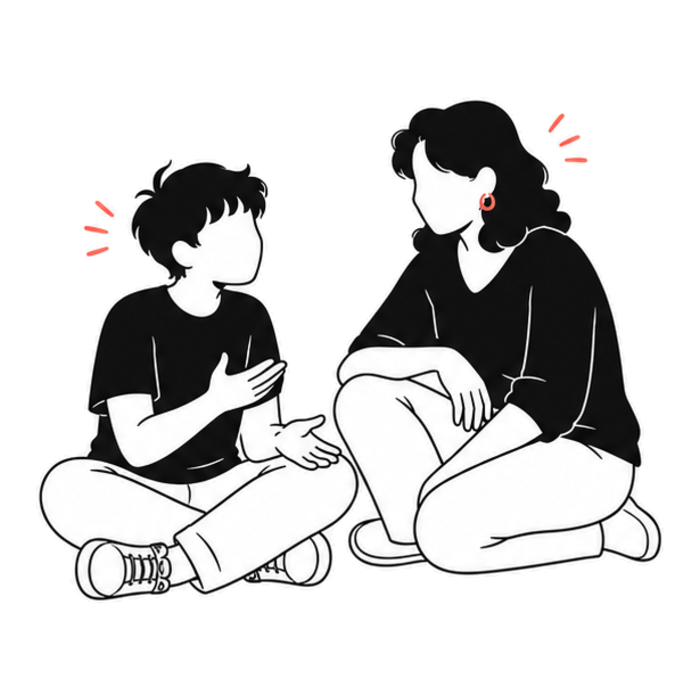A parent sitting with their teenager, listening